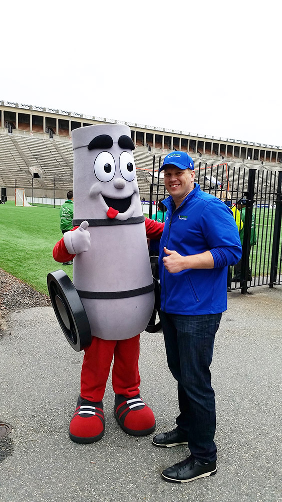 Chris with Boomer, the Boston Cannons' mascot