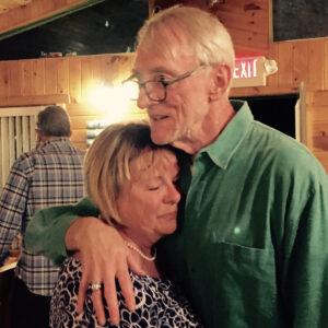 Former NHL coach and Legacy Donor Paul Theriault and wife hugging