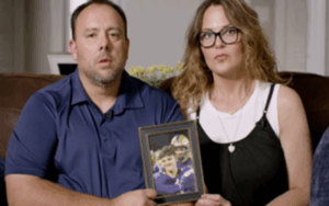The parents of Legacy Donor Wyatt Bramwell hold a framed picture of him