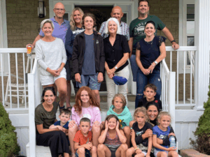 Legacy Donor Bruce McMillan with his family on the porch