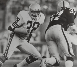 Former NFL player and Legacy Donor Cornell Webster chases down an opponent on the field