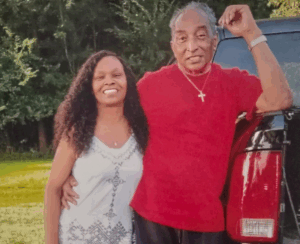 Former NFL player and Legacy Donor Cornell Webster leans on a truck alongside his wife Jan