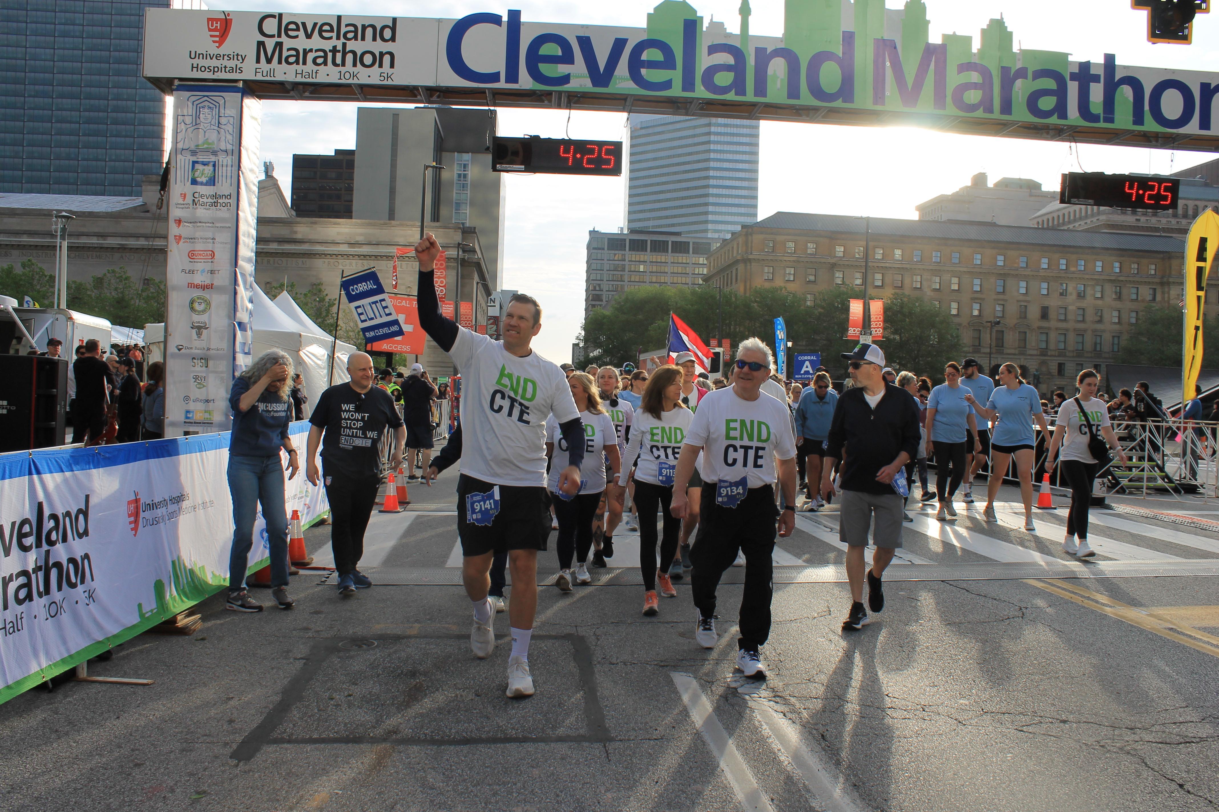 Concussion Legacy Foundation CEO Dr. Chris Nowinski crosses the finish line at the Race to End CTE in Cleveland
