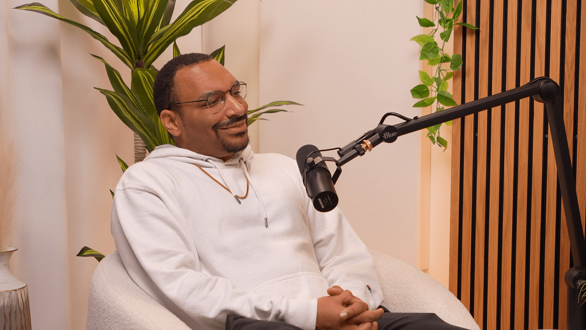 Chicago-based visual artist Anthony Bartley speaks into a microphone for CLF's Invisible Impact podcast