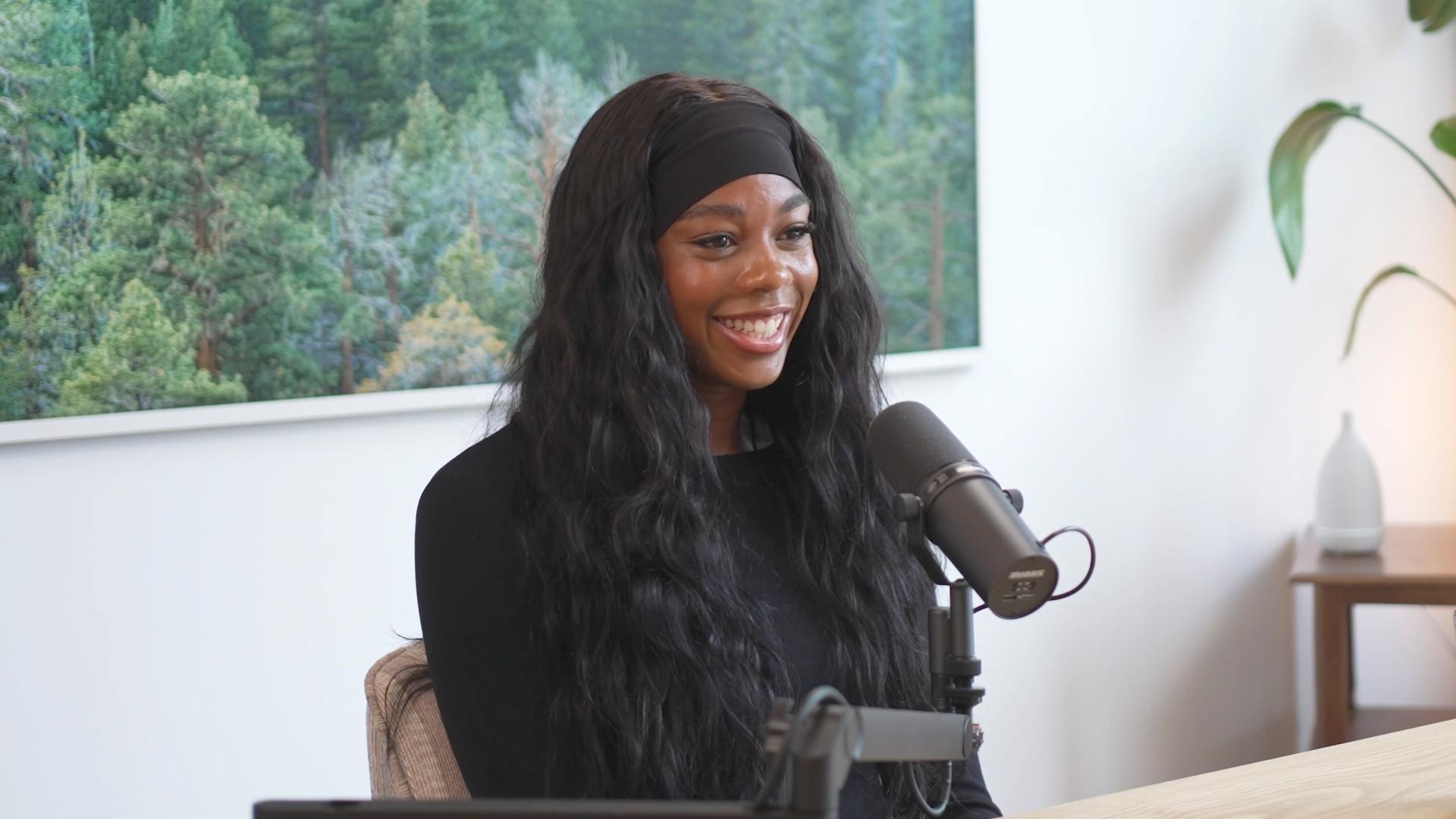 Professional soccer player Kennedy Faulknor speaks into a microphone for CLF's Invisible Impact podcast