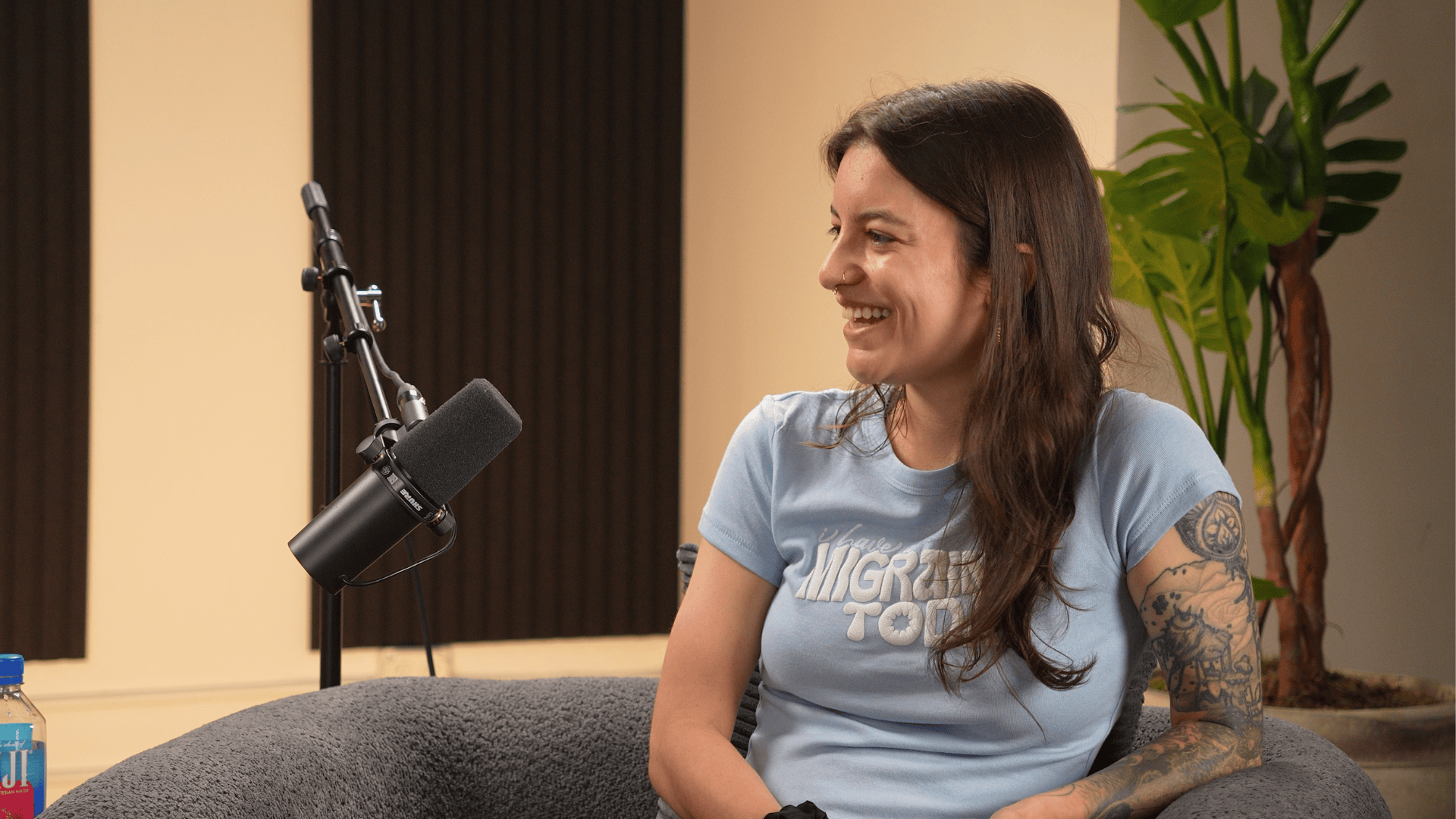 CarmenRose Fiallo speaks into a microphone for CLF's Invisible Impact podcast